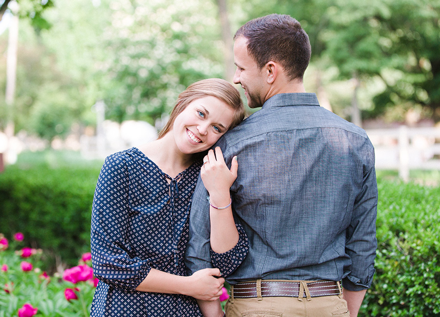 Her smiling with head on his shoulder