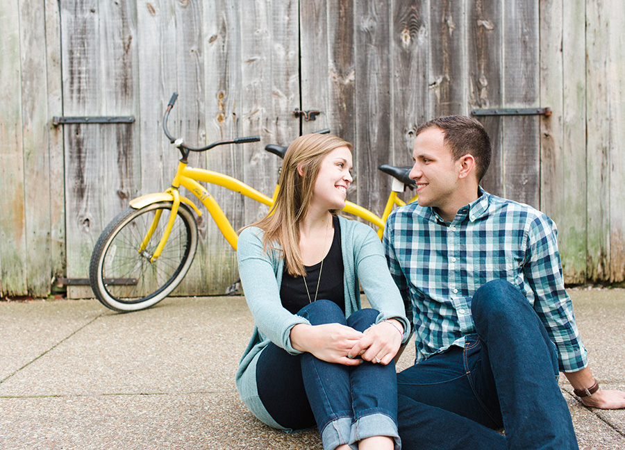 couple posing in front of bike