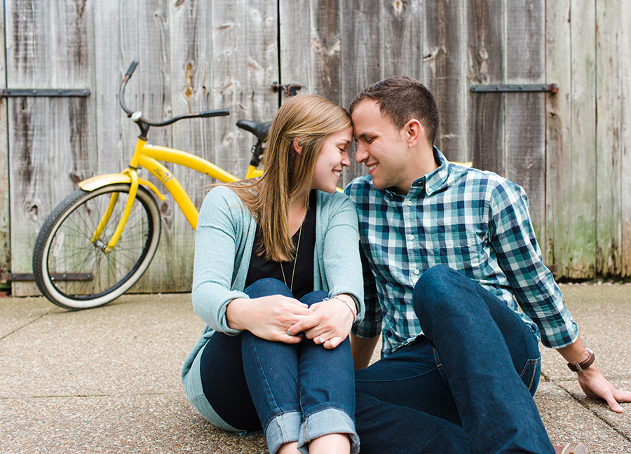 couple looking at eachother in front of bike