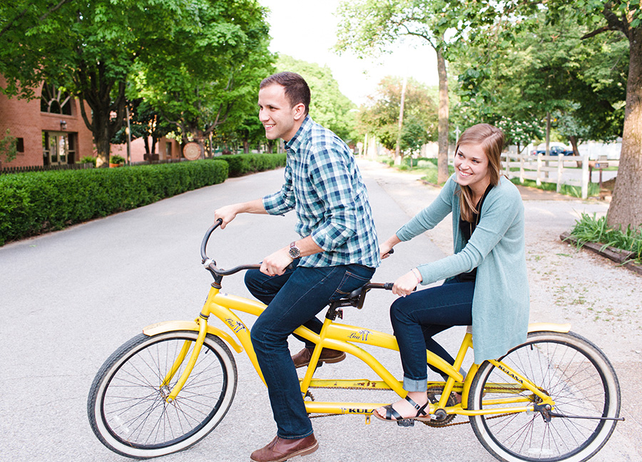 couple riding tandem bike