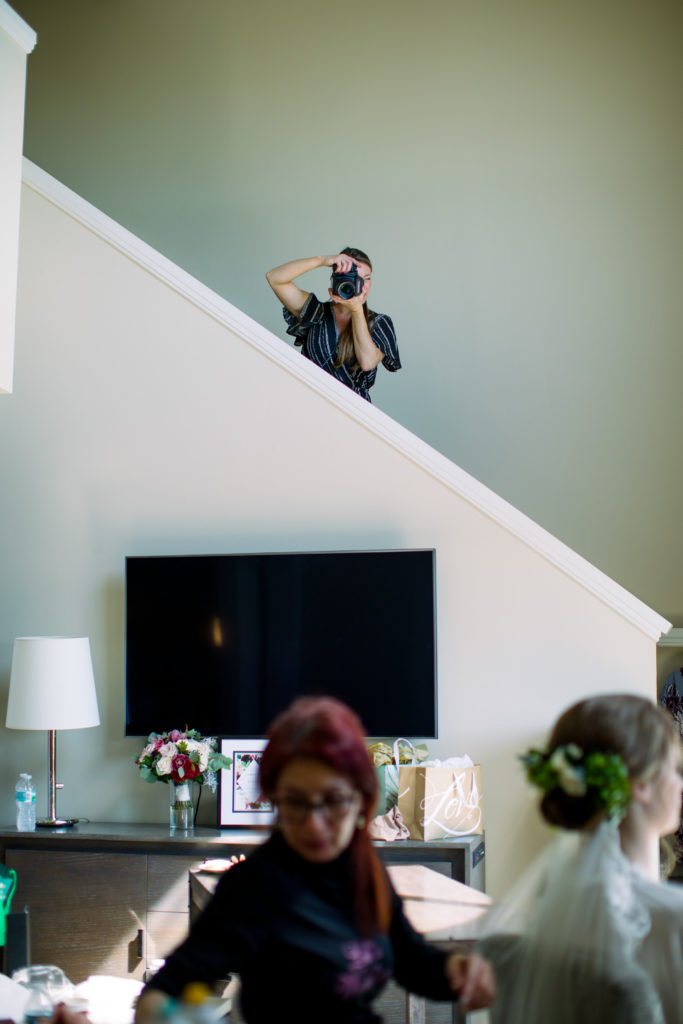 Sharin Shank Photography in action capturing getting ready images at a wedding in Clearwater Florida